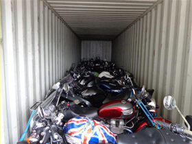 Motorbikes in container ready for shipping
